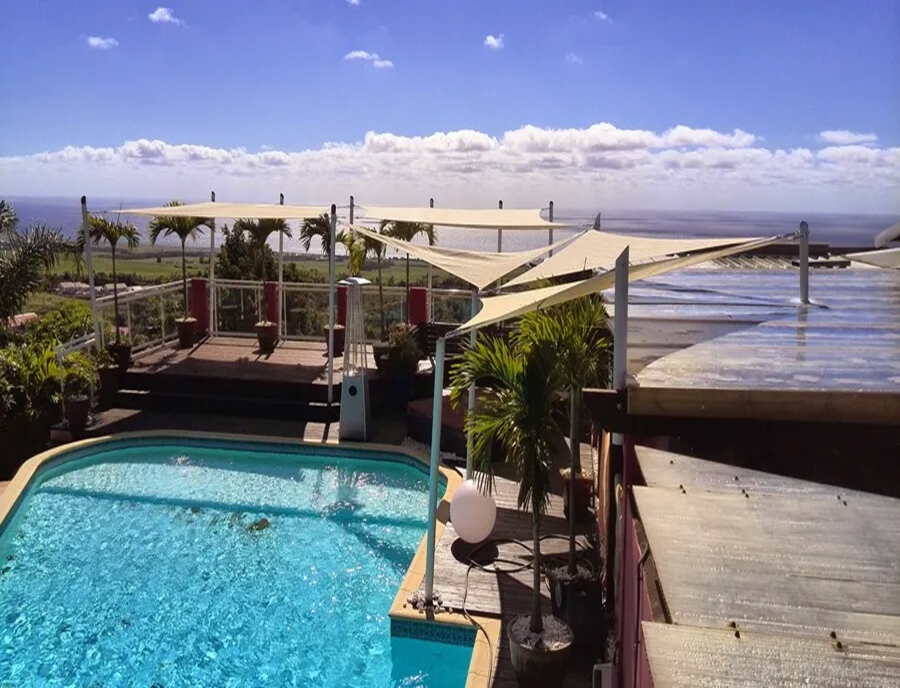 Five  shade sails by the ocean.webp width=900 height=688